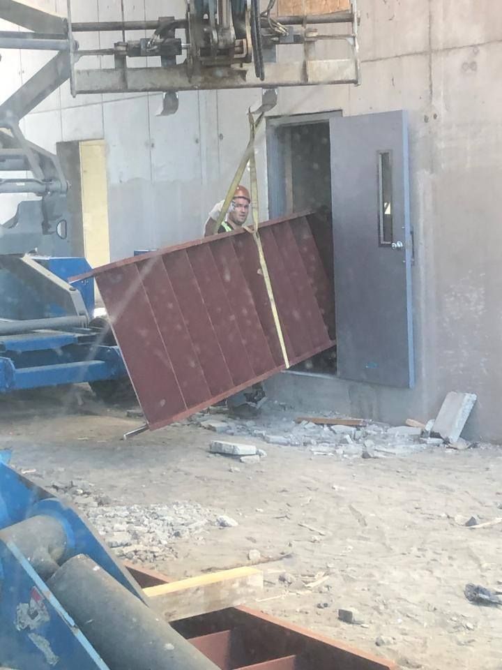 Structural steel stair system being installed inside commercial building