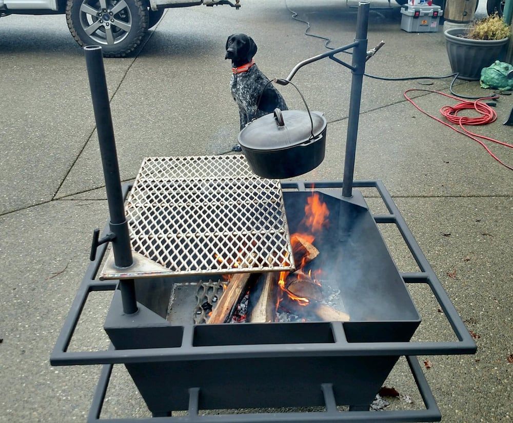 Custom fabricated steel fire pit grill with welded cooking grate