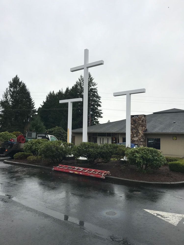 Custom fabricated steel cross structures for outdoor installation