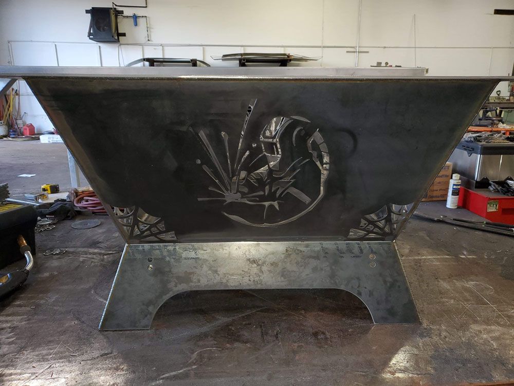 Custom fabricated steel bin with decorative cut-out metal design