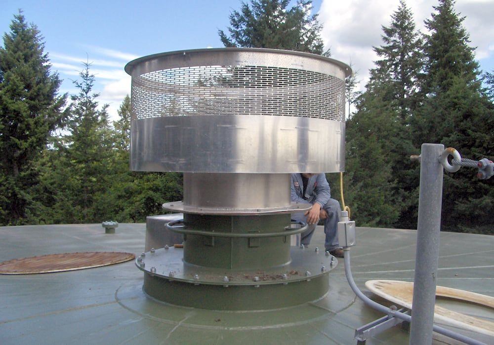 Large industrial rooftop vent with custom fabricated metal housing