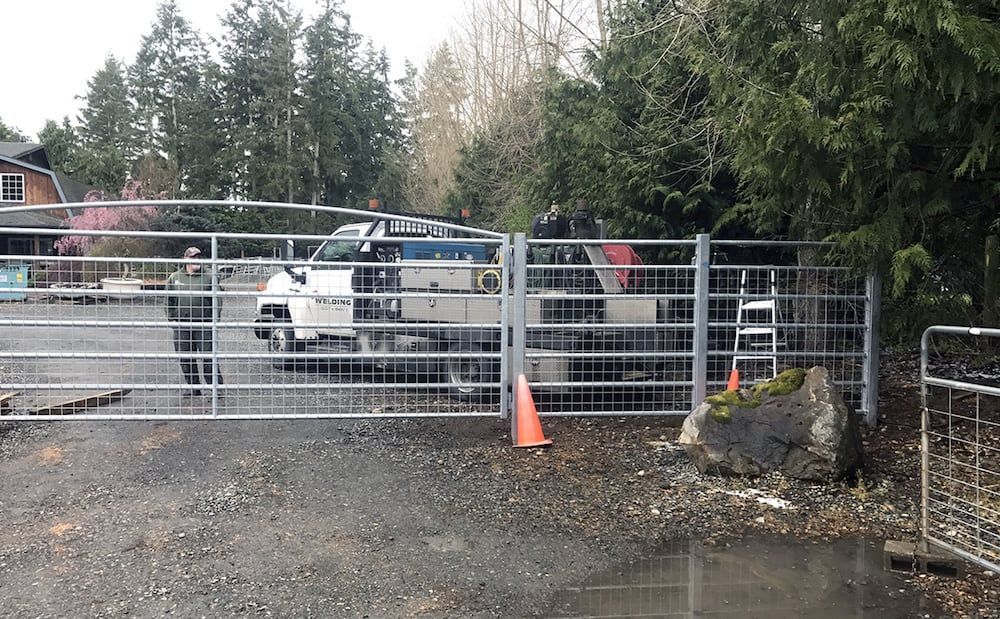 Custom welded steel livestock or utility gate for property access