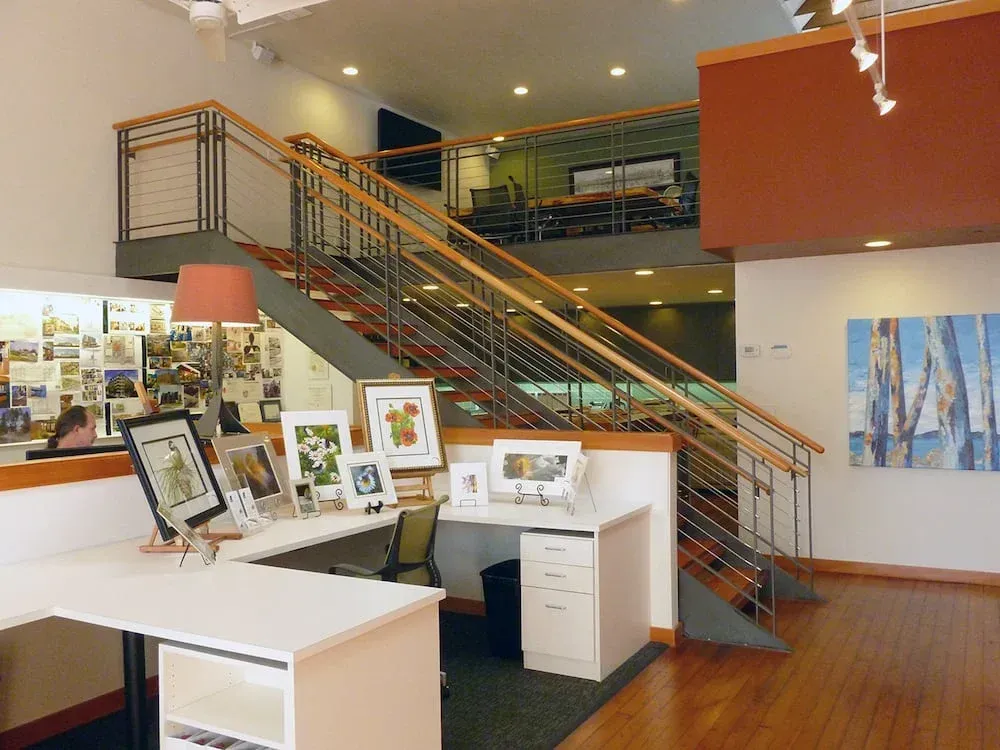 Commercial interior stairwell with custom welded steel cable railing system
