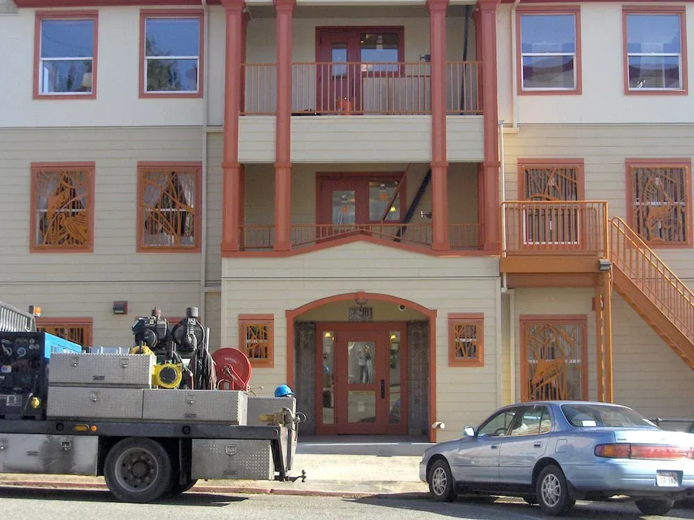 Residential building with custom welded steel balcony railing system