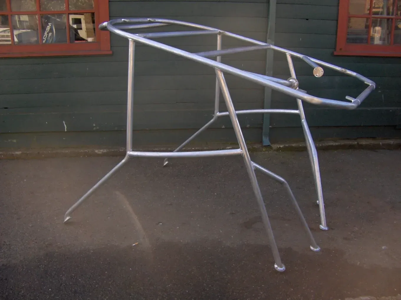 Custom fabricated steel frame structure with welded joints