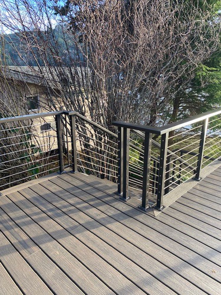 Residential deck with custom welded steel cable railing system