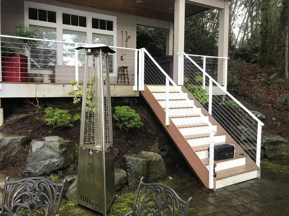 Custom outdoor staircase with welded steel railing and wood steps