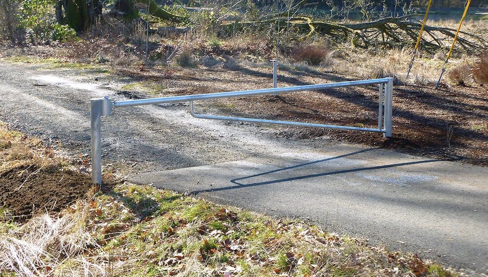 Custom fabricated steel barrier rail system for roadway