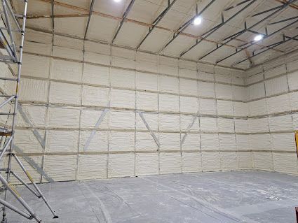 A large warehouse with a lot of foam on the walls and ceiling.