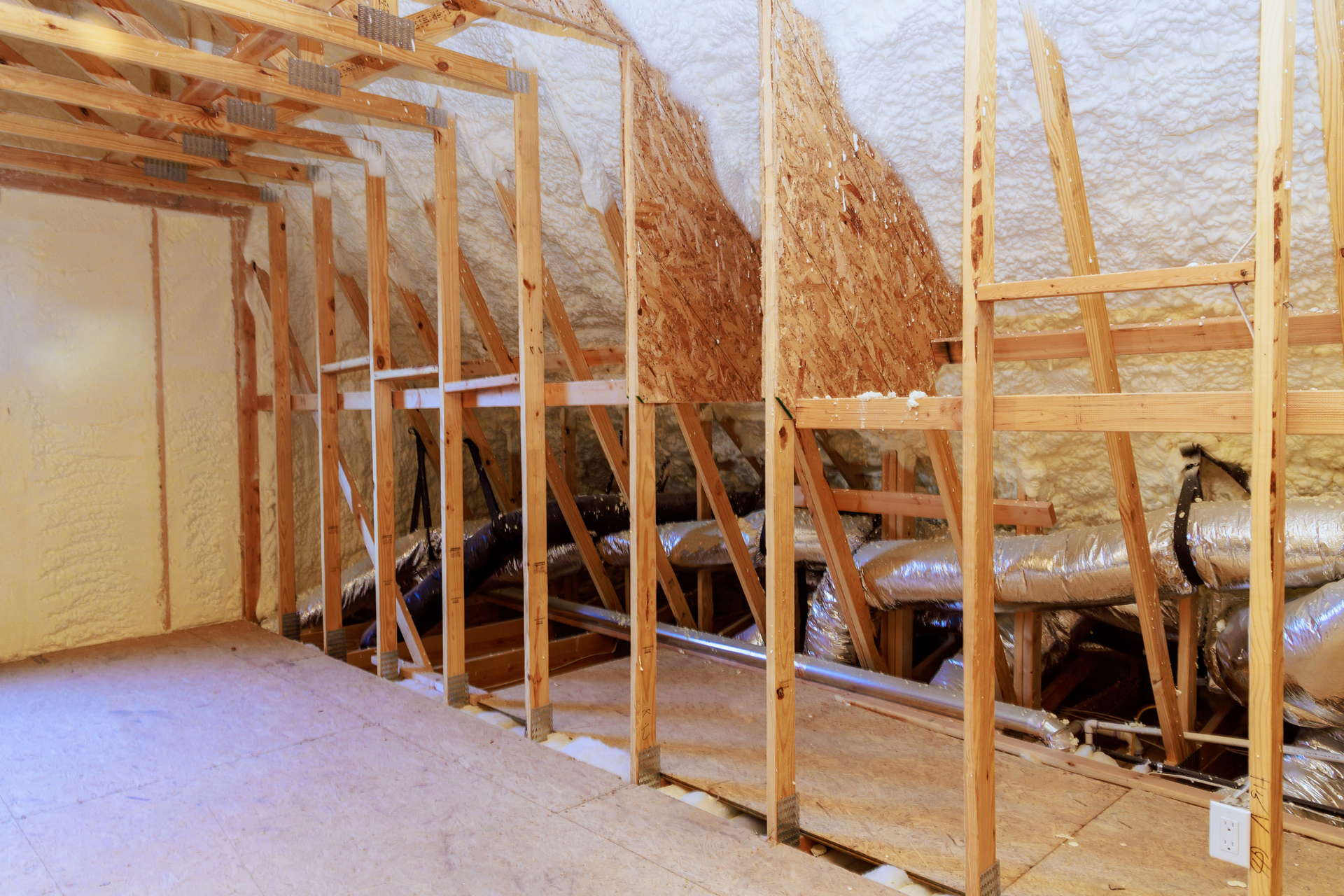 A room with a lot of wooden beams and pipes in it.
