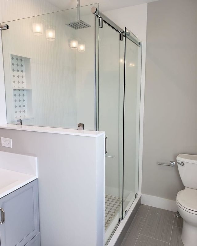 Custom frameless glass shower enclosure installed by Ocean Glass