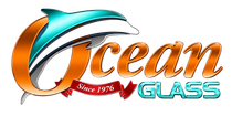 Ocean Glass logo with turquoise, orange, and silver swoosh design