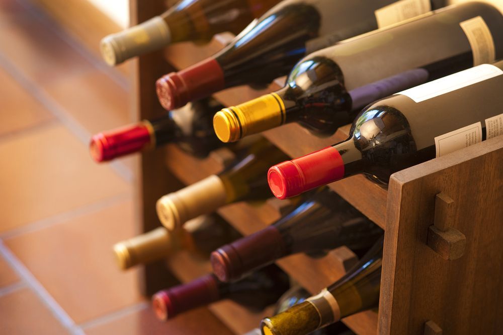 Wine Bottles in a Wooden Rack — BYO Cellars in Nelson Bay, NSW