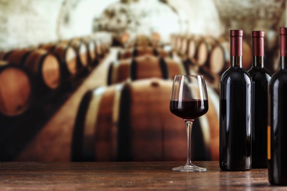 Wine Glass Filled With Red Wine — BYO Cellars in Medowie, NSW
