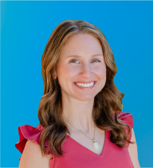 Smiling woman in a pink top against a bright blue background