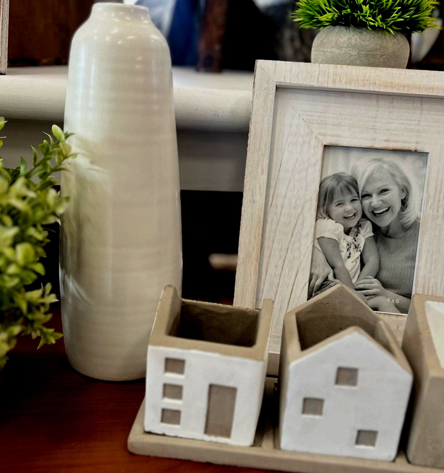 There is a picture of a woman and child in a frame on the table.