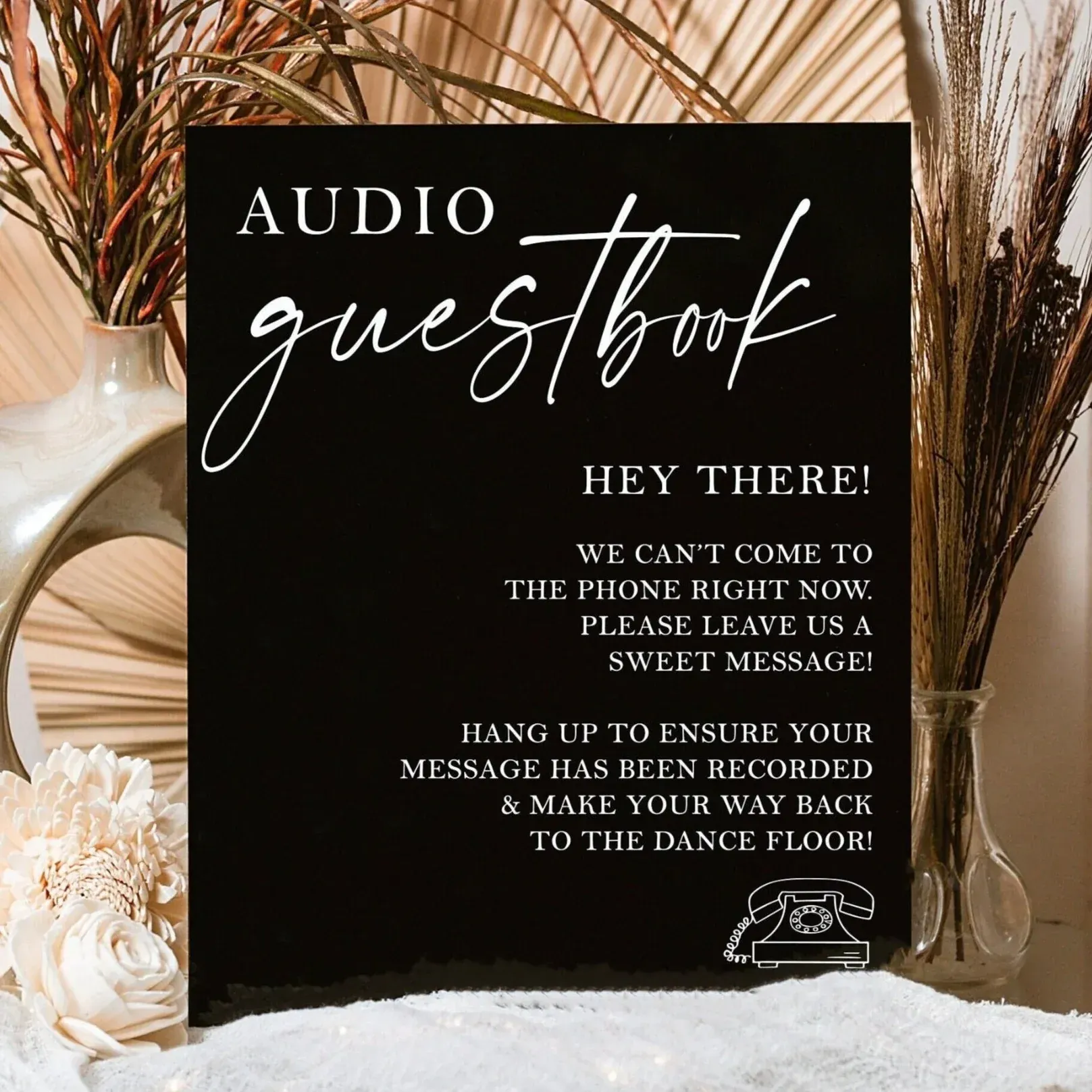 Black sign with white text: 