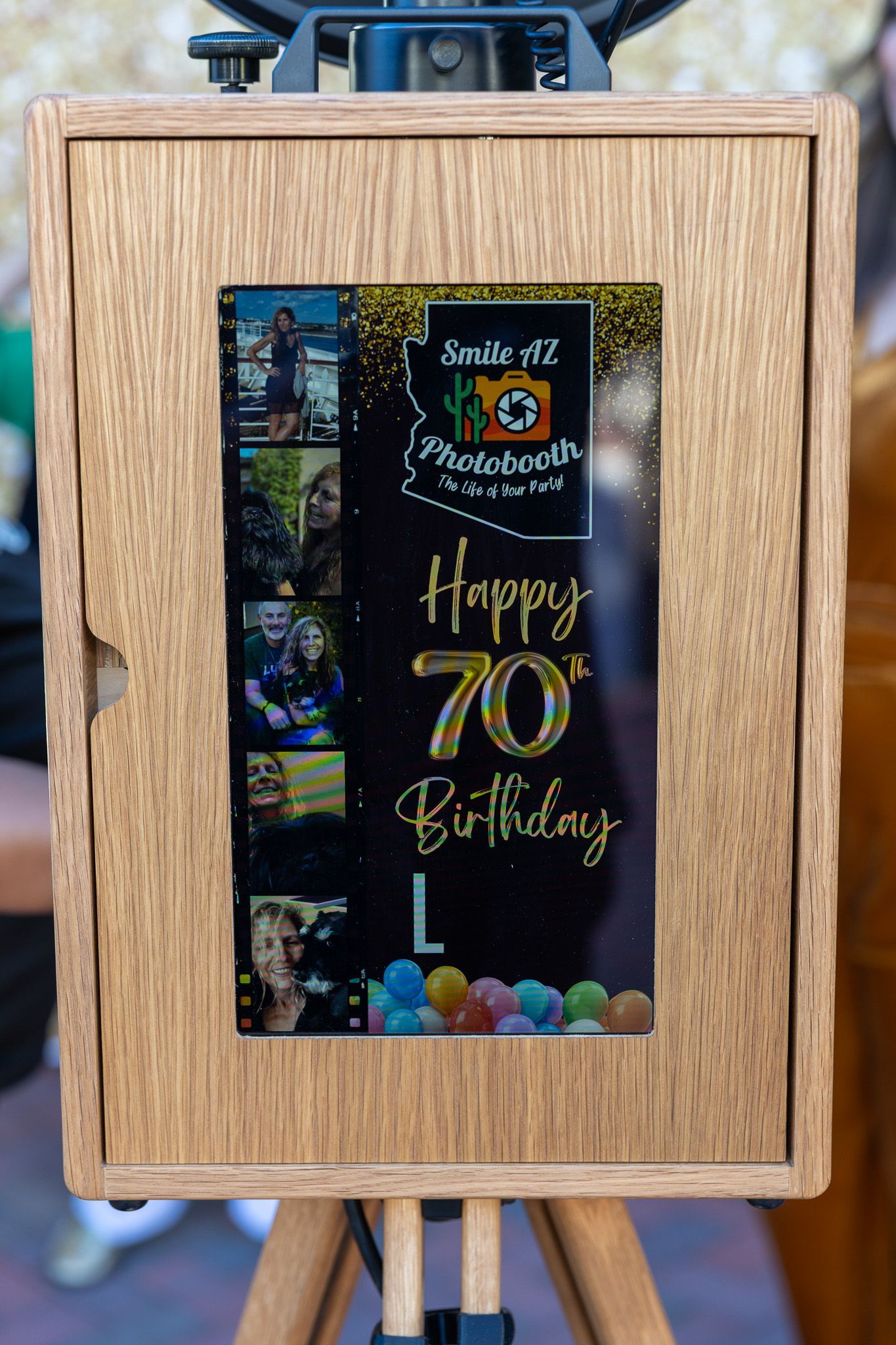 Photo booth with birthday message and guest photos.