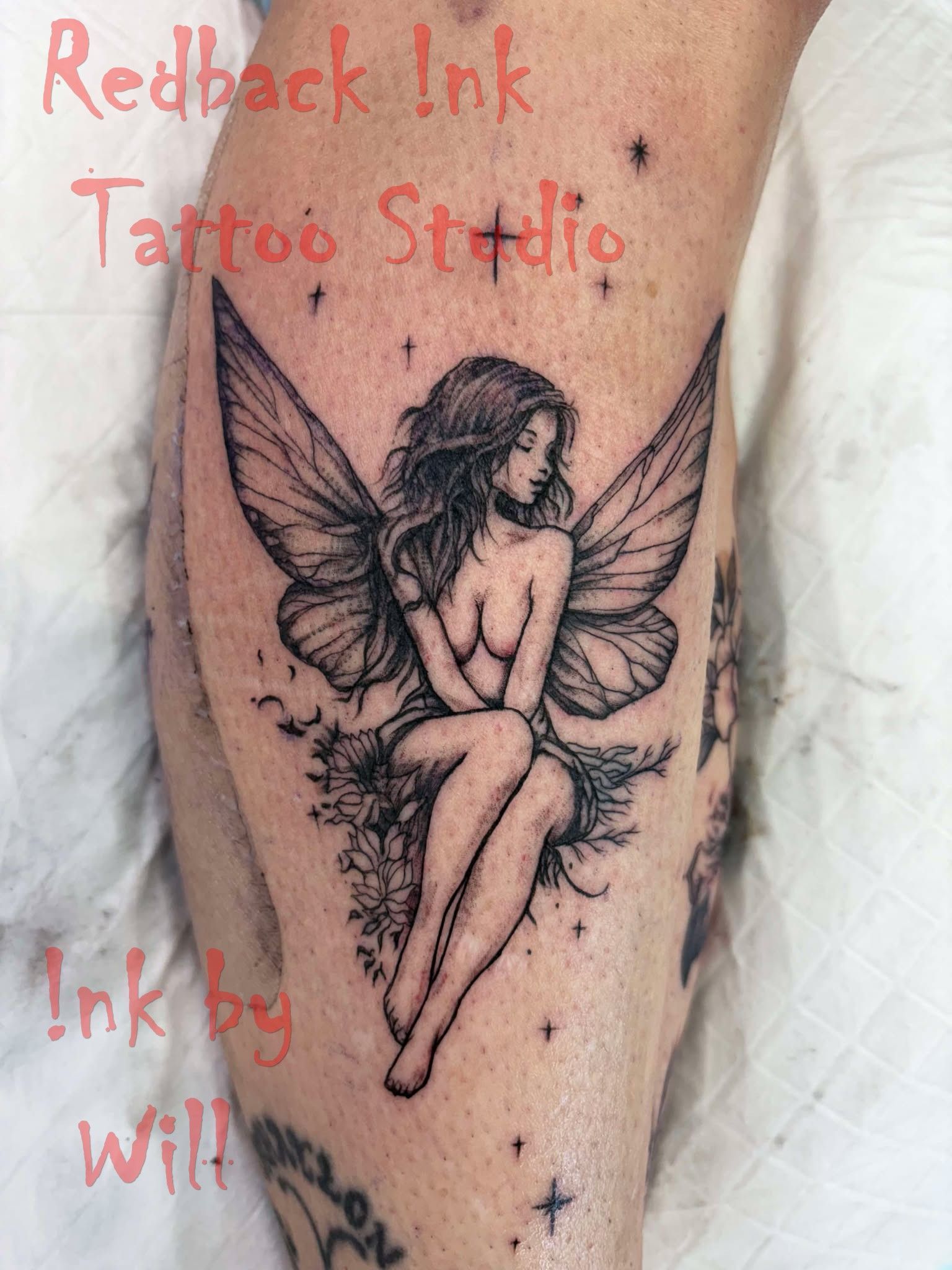 Fairy Tattoo on Leg. a Seated, Winged Woman With Long Hair — Redback !nk Tattoo Studio in Kawana, QLD