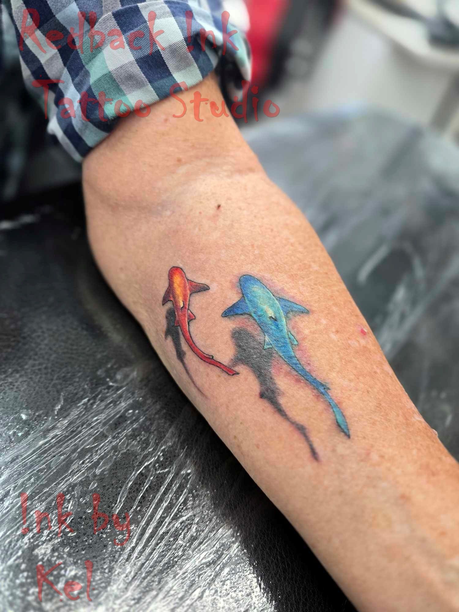 Tattoo of Two Colourful Koi Fish on a Person's Arm — Redback !nk Tattoo Studio in Kawana, QLD