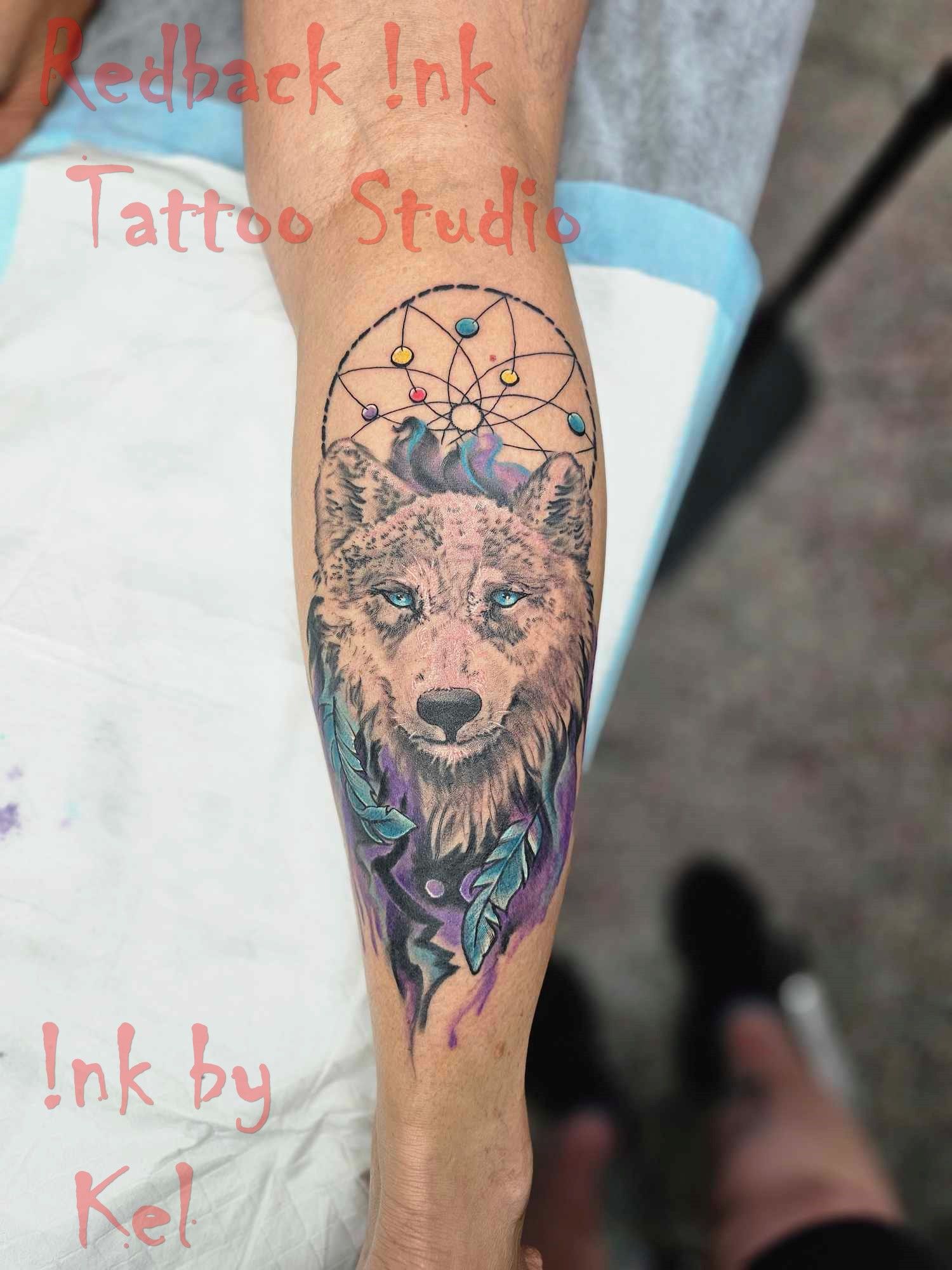 Leg Tattoo: Wolf Head, Dreamcatcher, Colorful Feathers — Redback !nk Tattoo Studio in Kawana, QLD