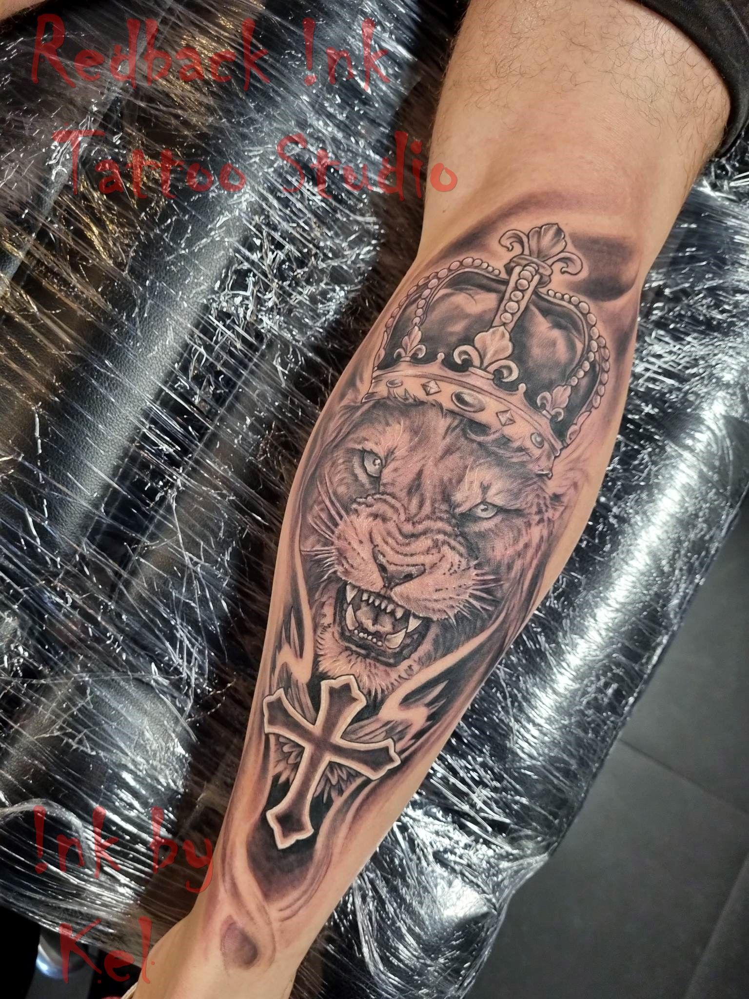 Lion's Head With Crown Tattoo on Arm; Grayscale — Redback !nk Tattoo Studio in Kawana, QLD