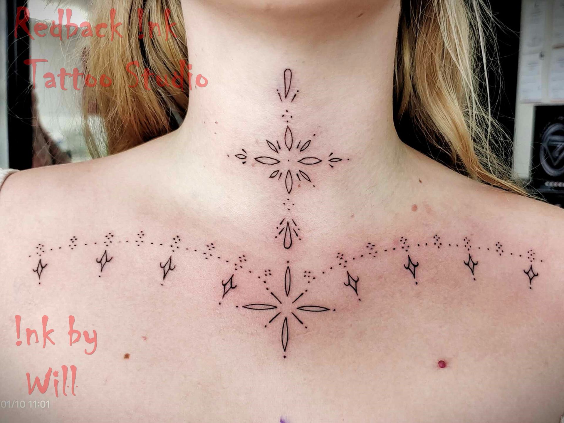 Neck and Upper Chest Tattoo of a Starburst and Dotted LINE Design — Redback !nk Tattoo Studio in Kawana, QLD