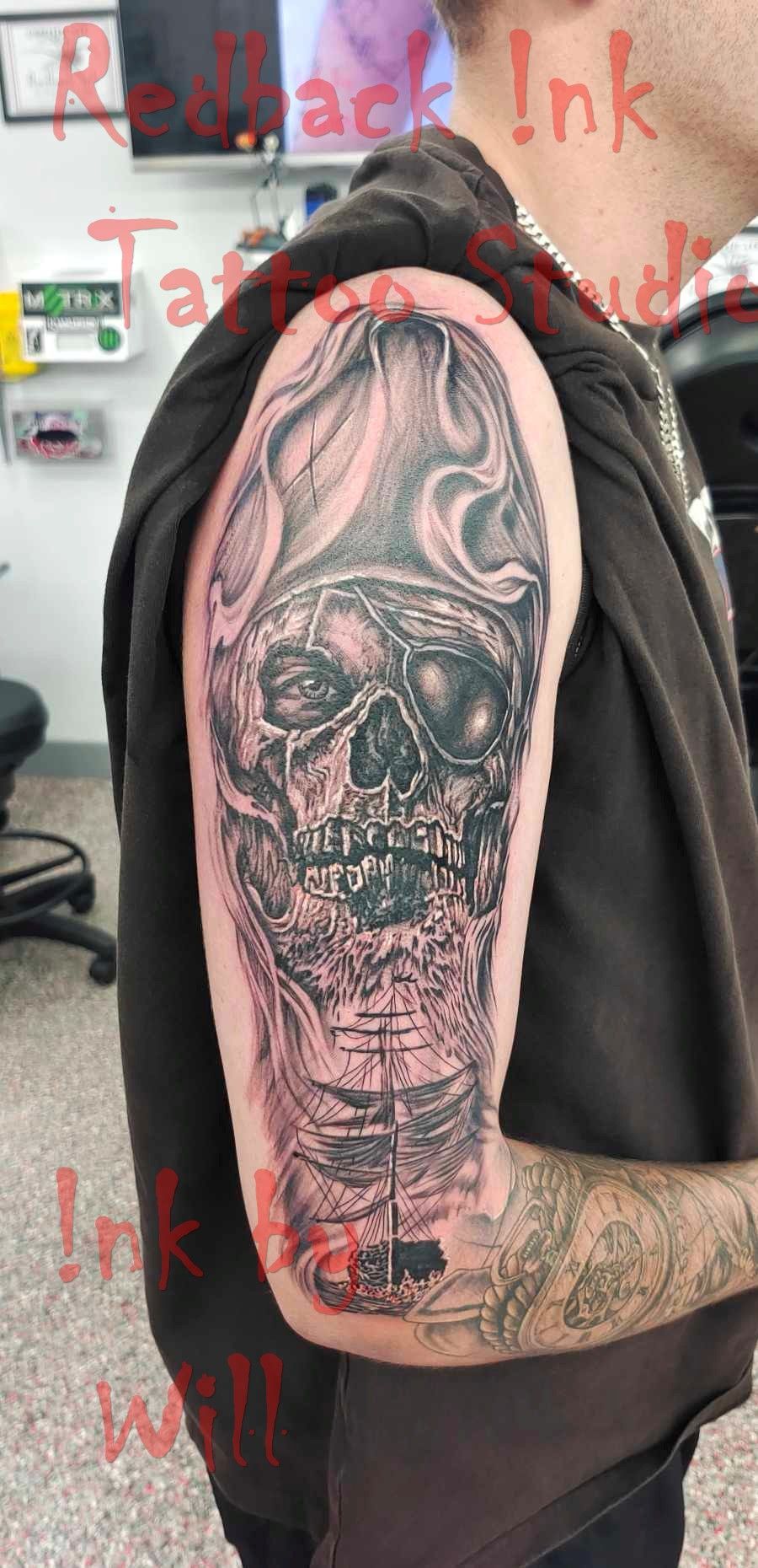 Pirate Skull Tattoo on a Man's Arm; Black and Grey Shading — Redback !nk Tattoo Studio in Kawana, QLD