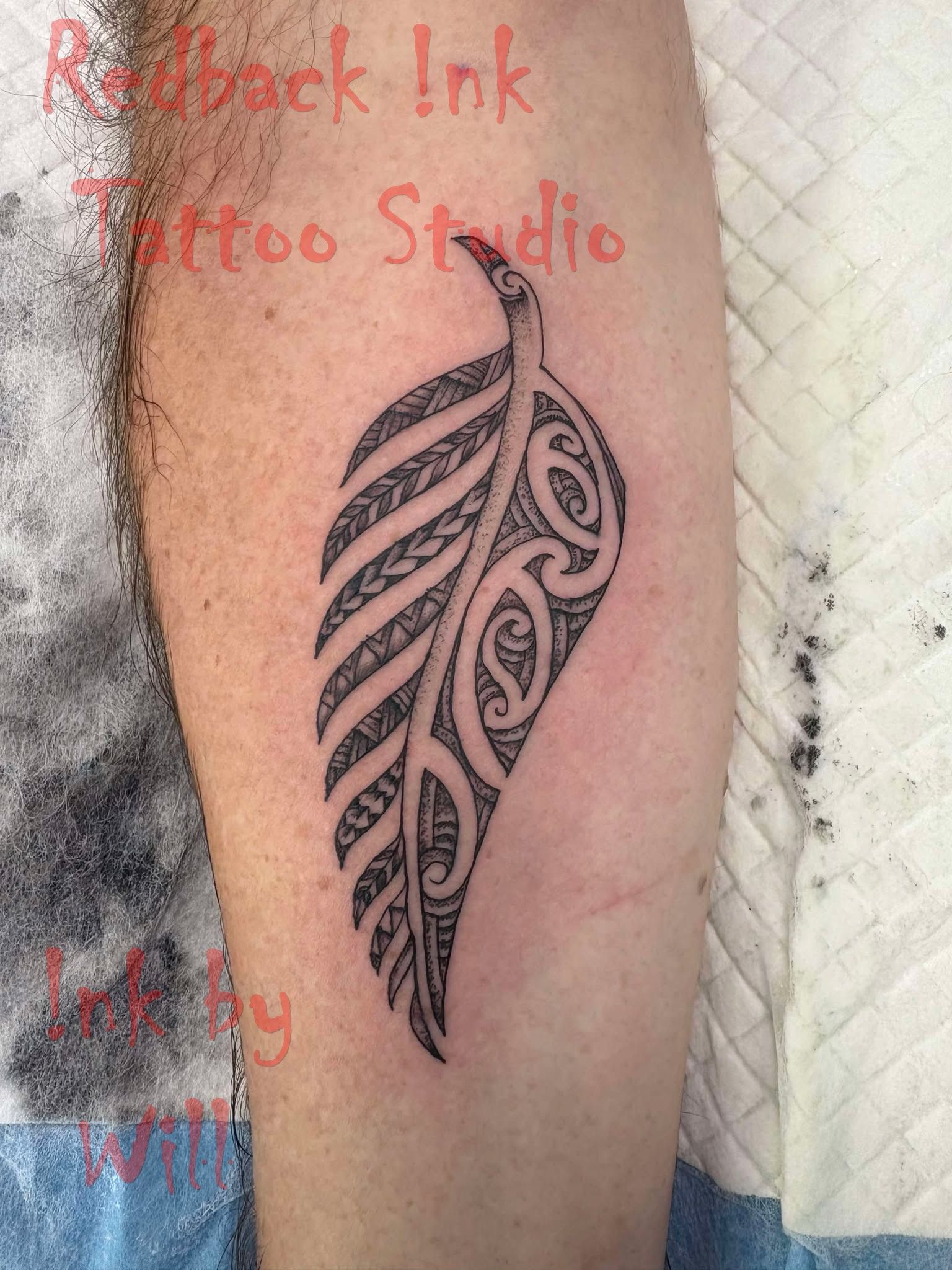 Black Tribal Leaf Tattoo on a Person's Leg, in a Studio Setting — Redback !nk Tattoo Studio in Kawana, QLD