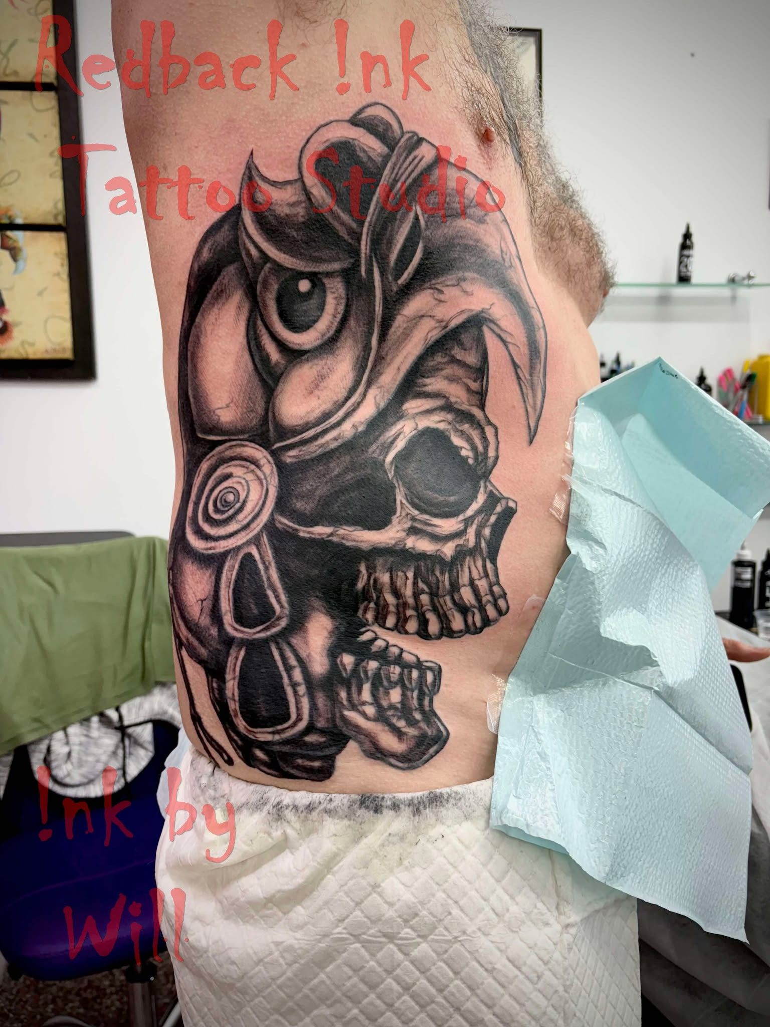 Tattoo on Torso: Skull and Owl Design in Black and Grey Shading — Redback !nk Tattoo Studio in Kawana, QLD