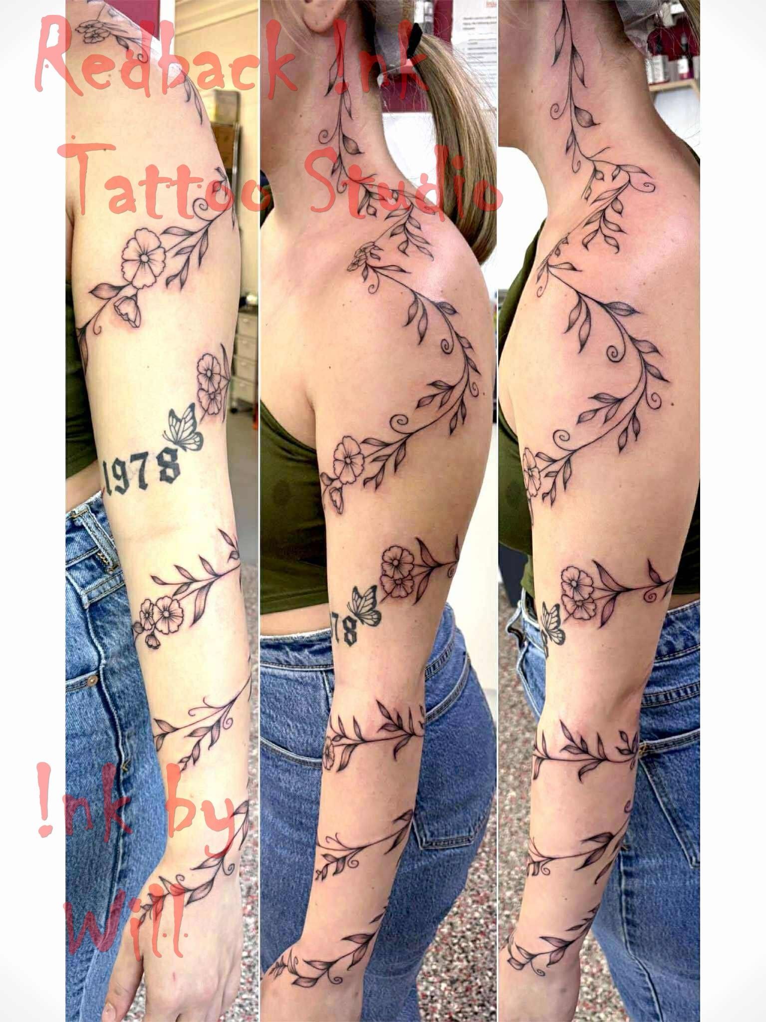 Woman With a Floral Vine Tattoo Up Her Arm, With the Year — Redback !nk Tattoo Studio in Kawana, QLD