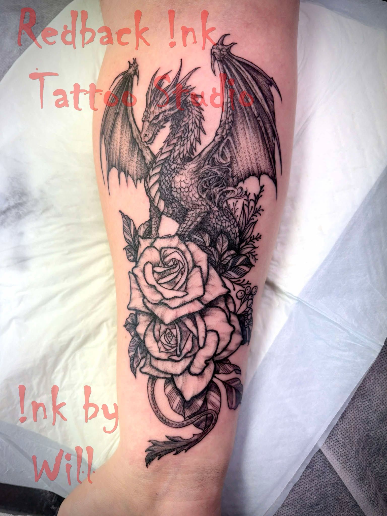 Dragon Tattoo With Roses on Forearm — Redback !nk Tattoo Studio in Kawana, QLD