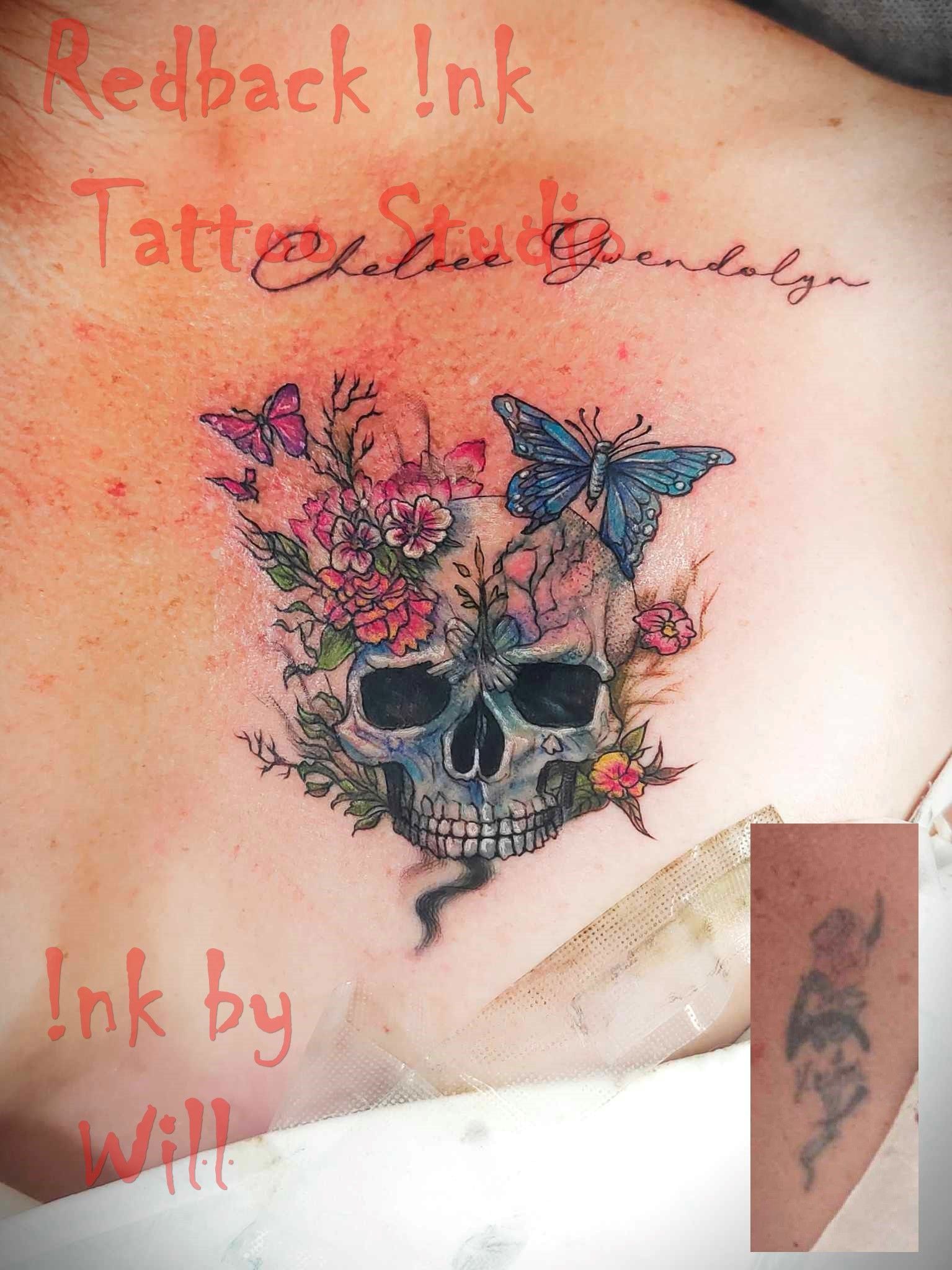 Skull Tattoo With Flowers and Butterflies, Chest Placement — Redback !nk Tattoo Studio in Kawana, QLD