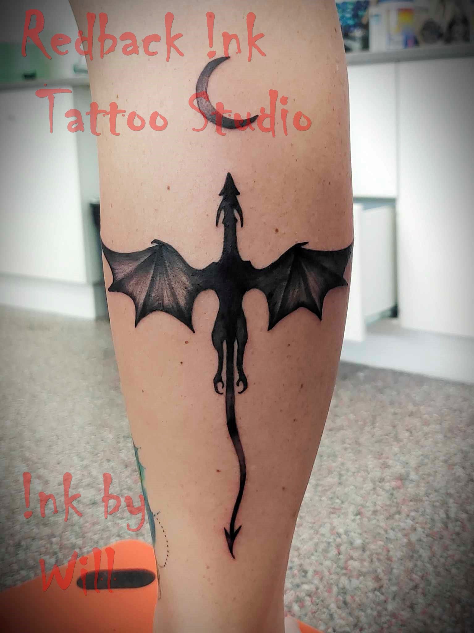 Dragon Tattoo on an Arm, Black Ink — Redback !nk Tattoo Studio in Kawana, QLD