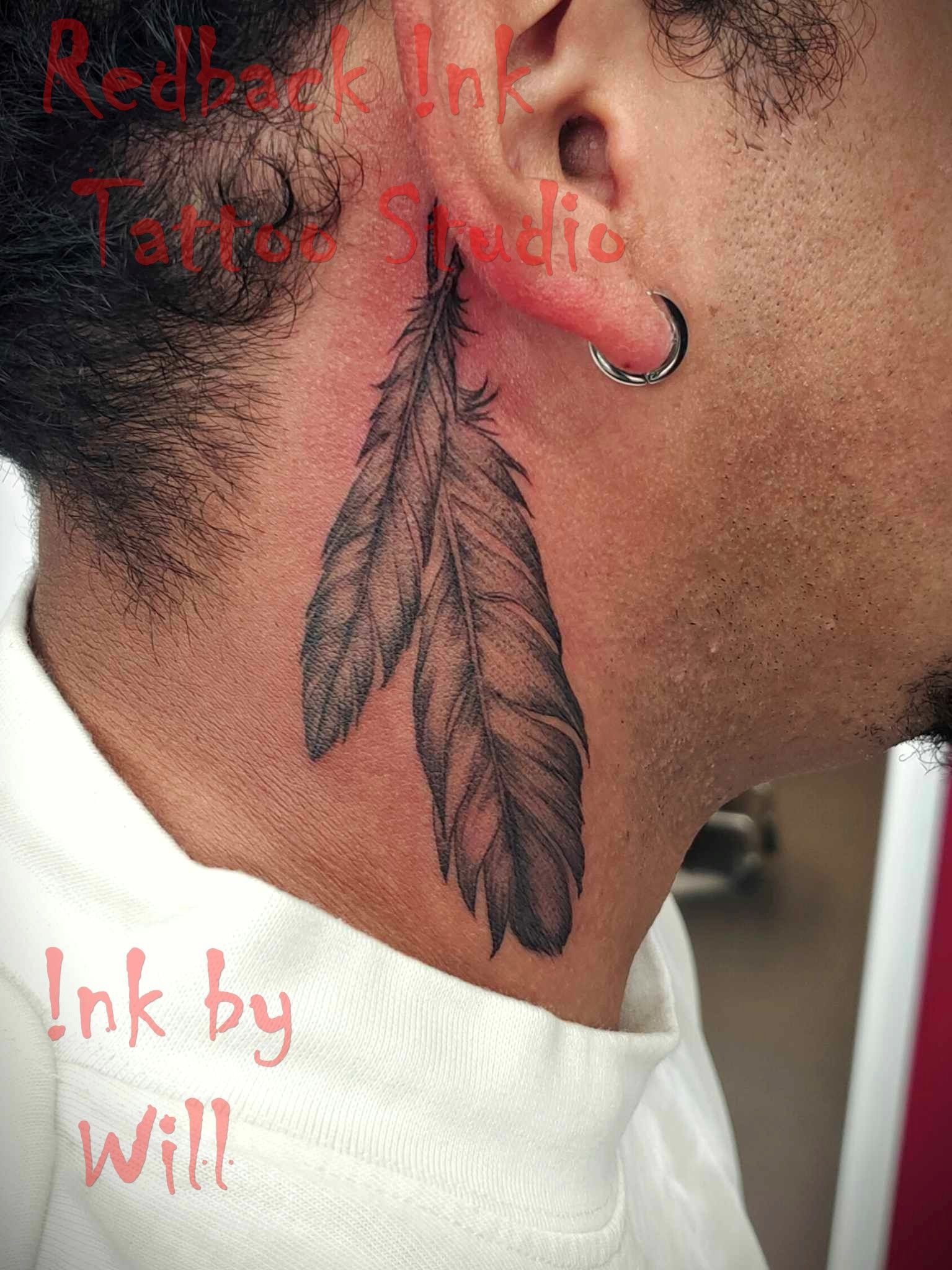 Tattoo of Two Gray Feathers on a Person's Neck, Near Their Ear — Redback !nk Tattoo Studio in Kawana, QLD