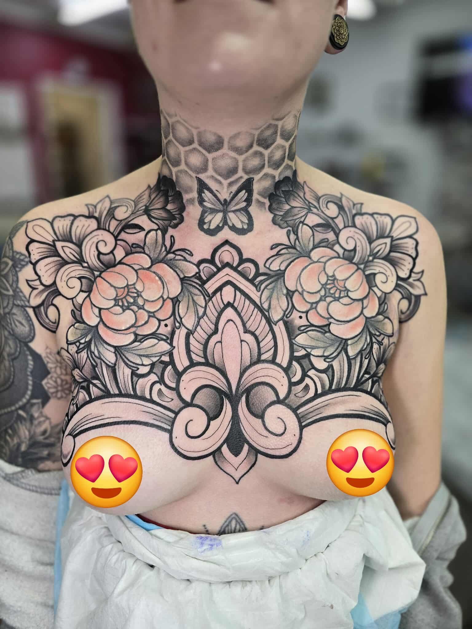 Tattooed Chest and Neck: Flowers, Fleur-de-lis, Butterfly — Redback !nk Tattoo Studio in Kawana, QLD