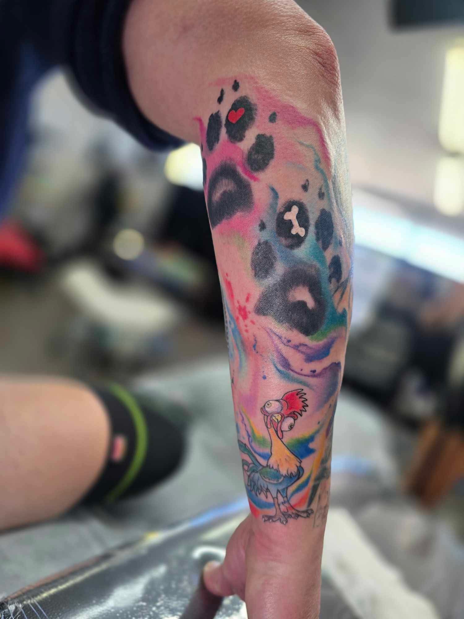 Colourful Watercolor Tattoo on Forearm, Features Paw Prints, Abstract Shapes — Redback !nk Tattoo Studio in Kawana, QLD