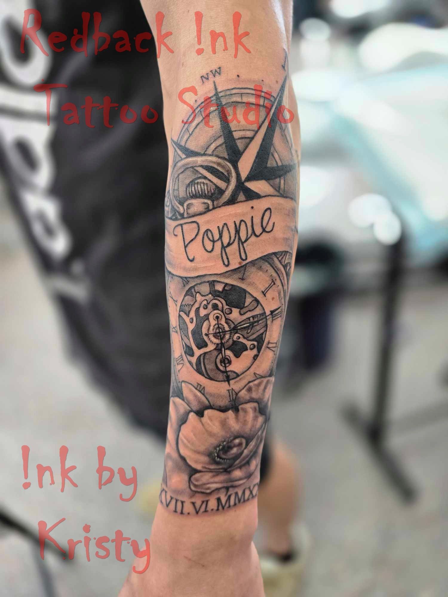 A Forearm Tattoo of a Compass, Banner — Redback !nk Tattoo Studio in Kawana, QLD