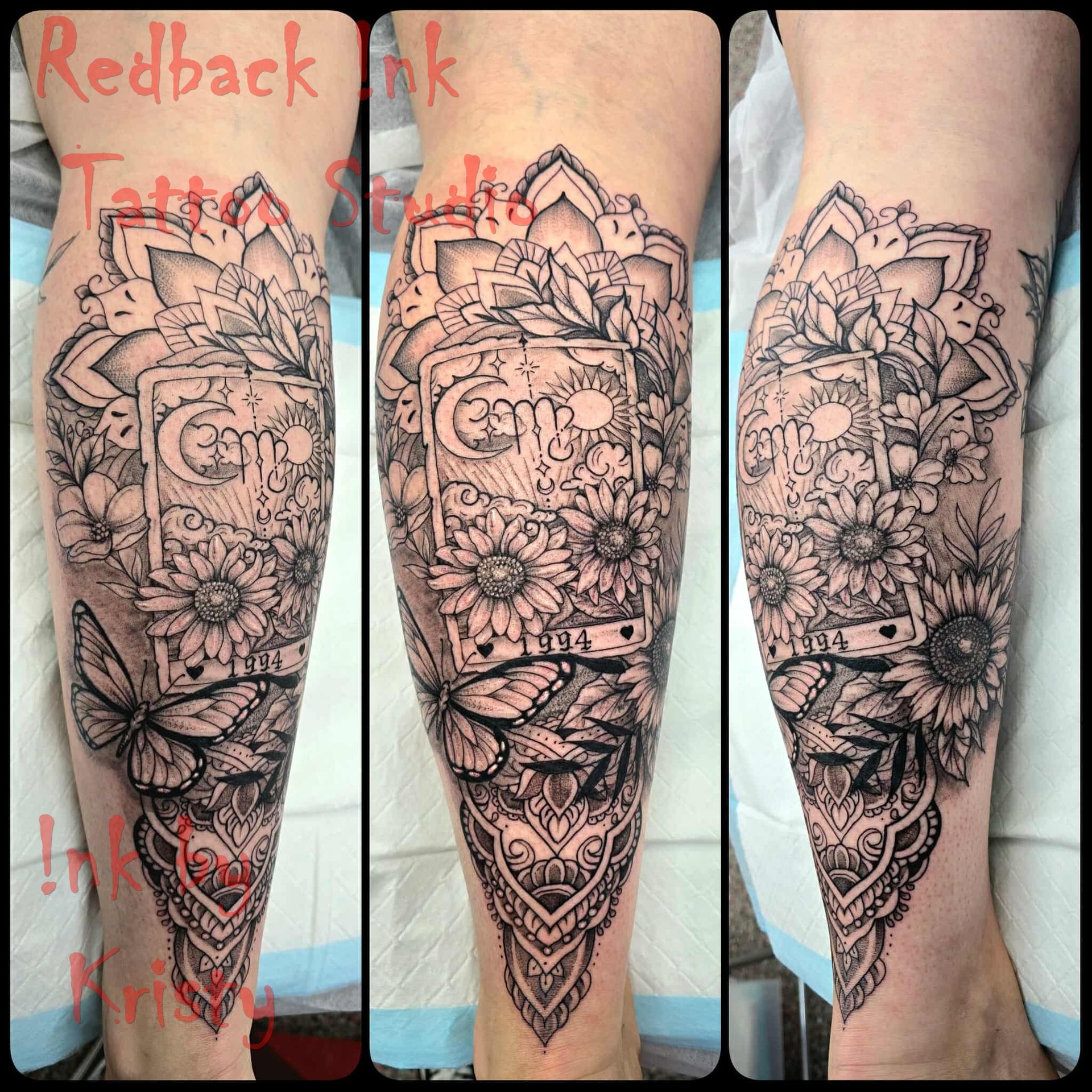 Black and white tattoo of flowers, butterflies, and a book on a leg. — Redback !nk Tattoo Studio in Kawana, QLD