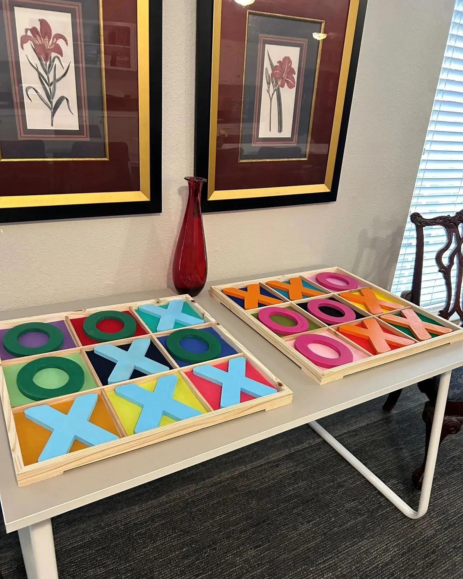 Colorful tic-tac-toe game pieces on table at Treemont Senior Community in Houston, Texas