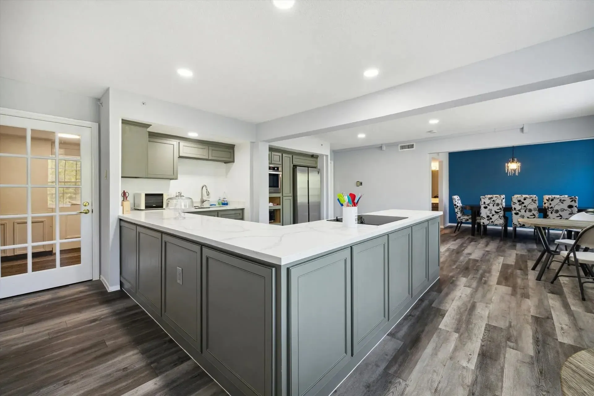 Gray cabinetry with white countertop at Treemont Senior Community in Houston, Texas