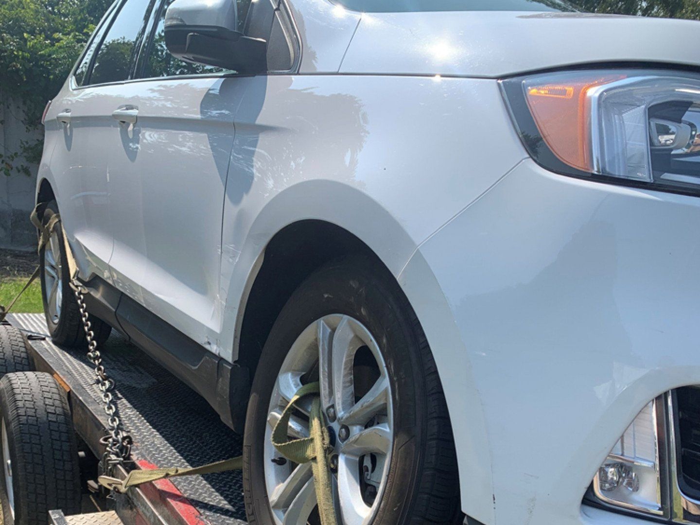 tow truck towing white car