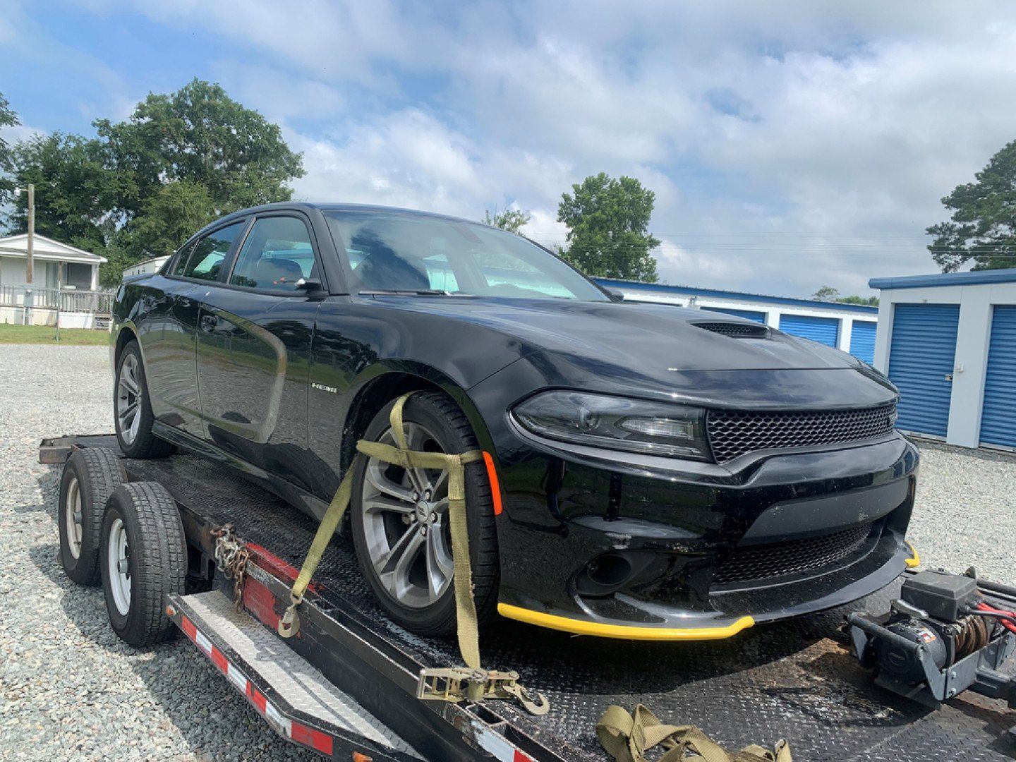 tow truck towing black car