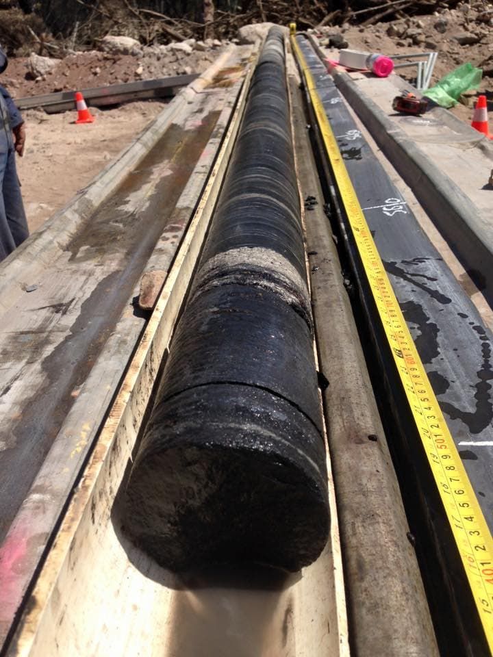 A Large Black Object is Being Measured by a Tape Measure — Kowaltzke Drilling Services in Gatton, QLD