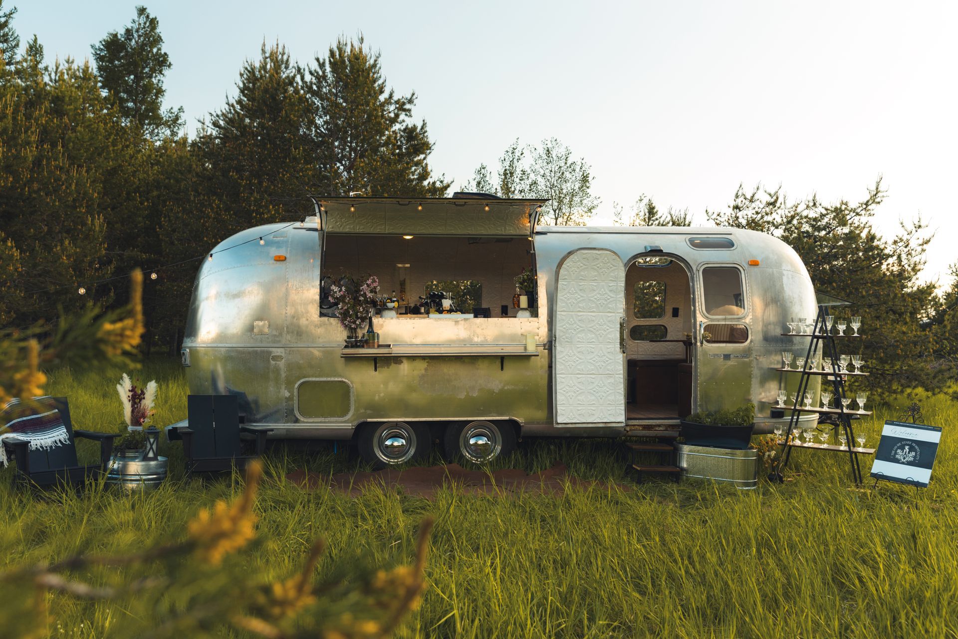 Airstream mobile bar serving drinks at Montana wedding
