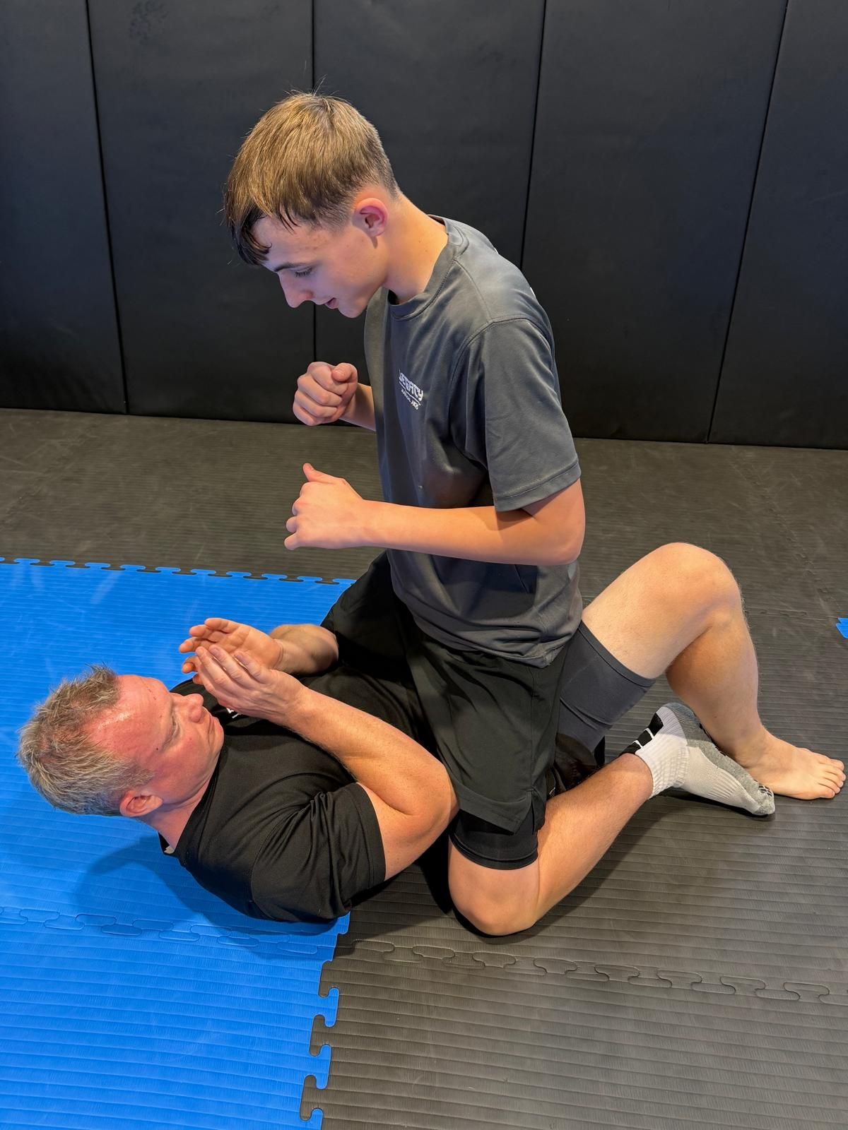 Two opponents grappling Two opponents grappling