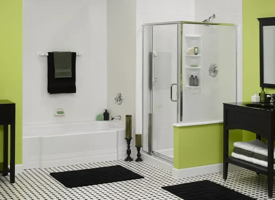 Modern bathroom with white sink, wooden vanity, bathtub shower, and light gray tile walls