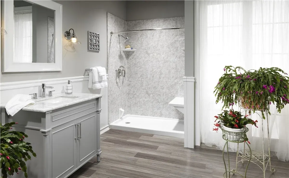 Modern bathroom with freestanding tub, double vanity, and white tile shower