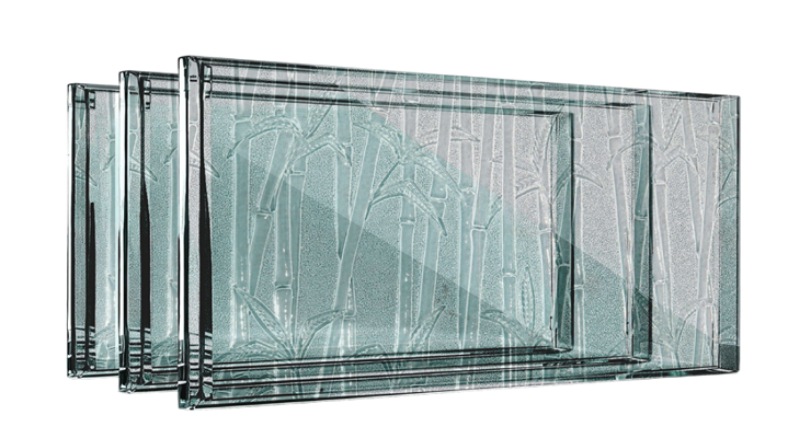 Four rectangular glass blocks, stacked, with a textured surface.