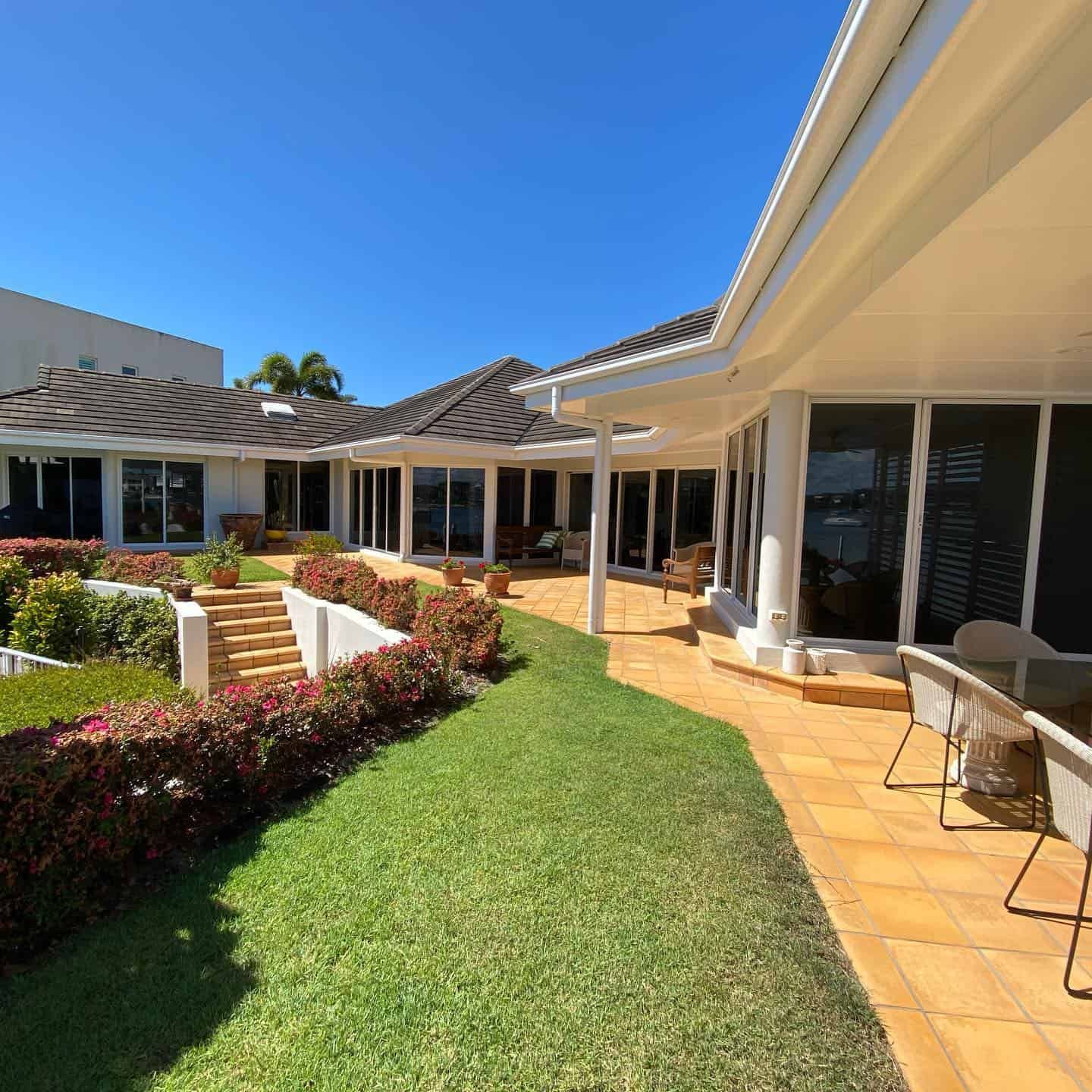 A Large House With A Lot Of Windows And A Patio — Home Tint Sunshine Coast Window Tinting In Maroochydore, QLD